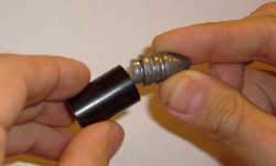 Picture of bullet being put into shell